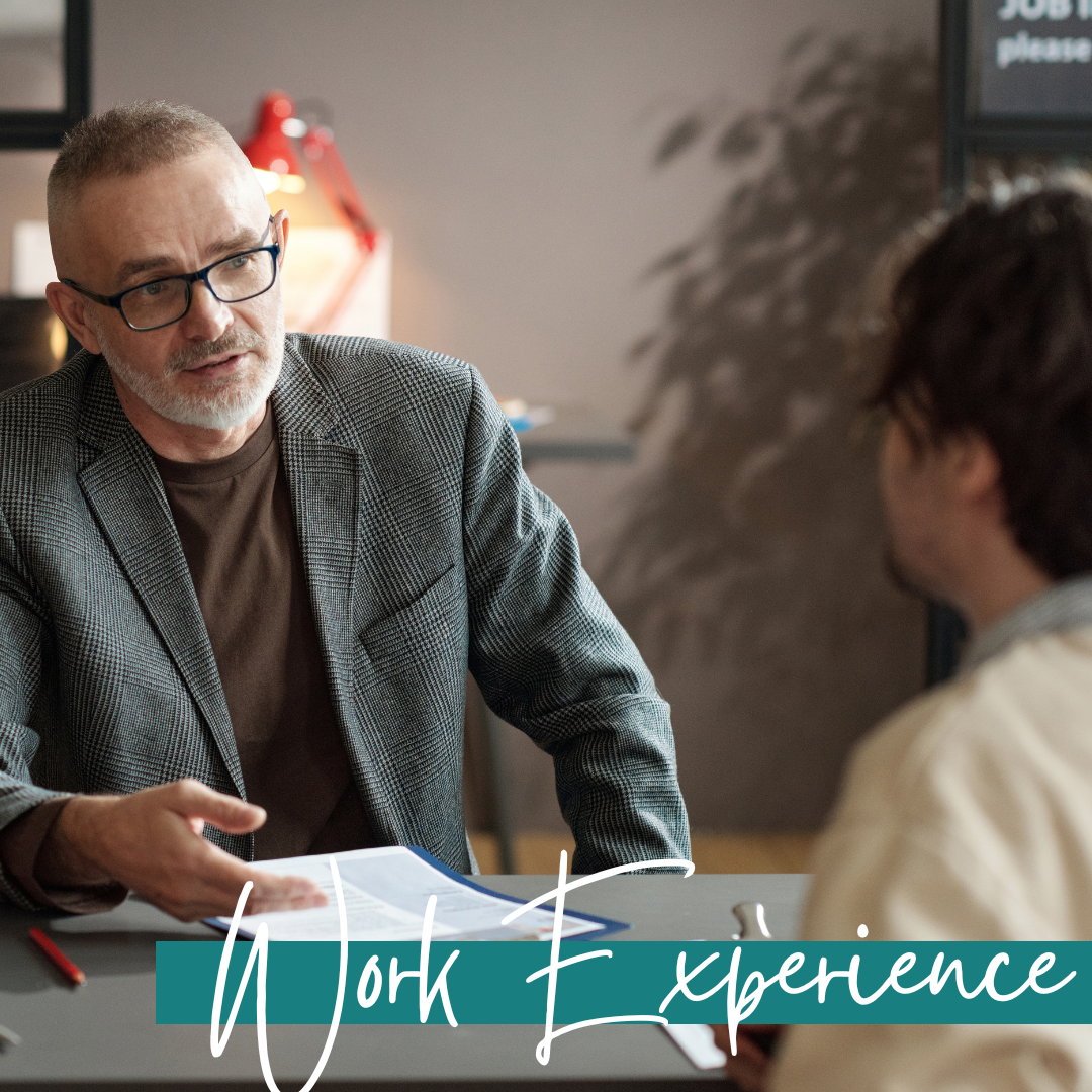 mature businessman with glasses discussing work experience with a candidate, the banner across the image has the words work experience